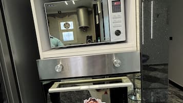 Luxury Apartment, River View | Private kitchen | Full-sized fridge, microwave, oven, stovetop