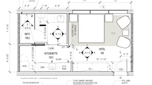 Grundriss eines Hotels mit Küchenzeile, Bad und Hotelzimmer.