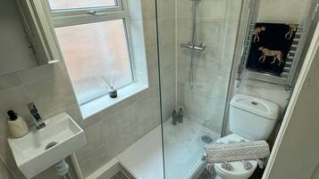 Shower, hair dryer, towels, soap