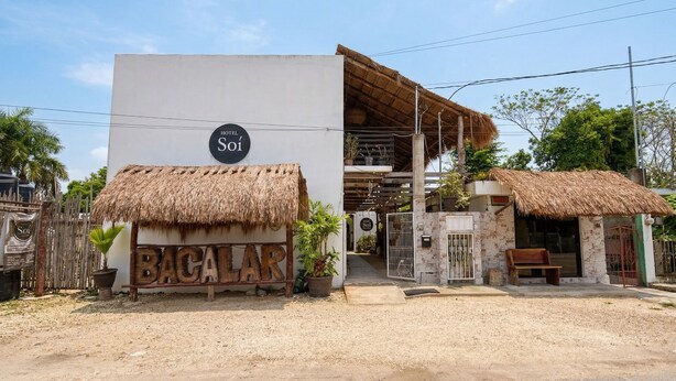 A hotel named 'Sói' with a signboard reading 'BACALAR' and a thatched-roof structure. - Soi Bacalar (Bacalar)