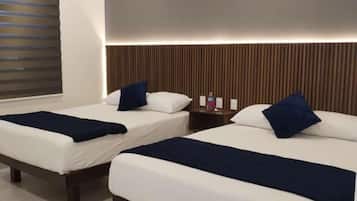 Habitacion Elite Deluxe, Planta Alta (107) | Cortinas blackout, wifi gratis y ropa de cama