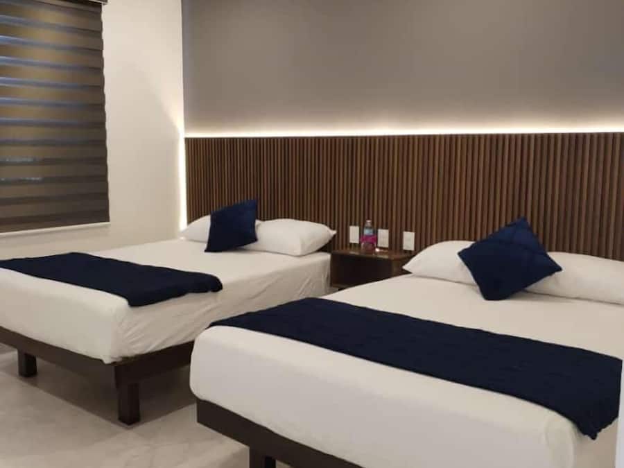 Cortinas blackout, wifi gratis y ropa de cama