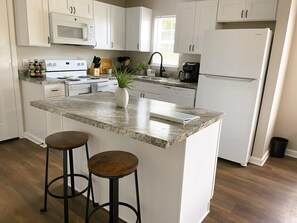 Fridge, microwave, oven, cookware/dishes/utensils