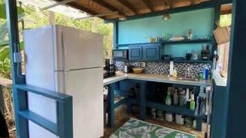 Fridge, microwave, coffee/tea maker, cookware/dishes/utensils