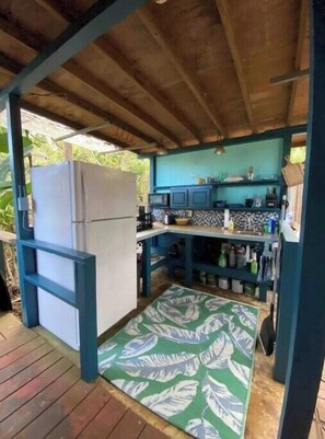 Fridge, microwave, coffee/tea maker, cookware/dishes/utensils