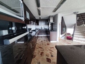 Fridge, stovetop, coffee/tea maker, cookware/dishes/utensils