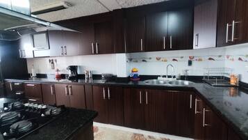 Fridge, stovetop, coffee/tea maker, cookware/dishes/utensils