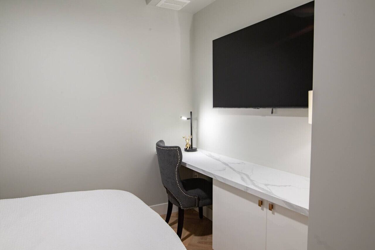 1 bedroom, desk, iron/ironing board, travel crib