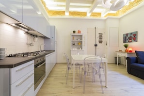 Fridge, stovetop, toaster, cookware/dishes/utensils