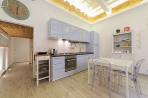 Fridge, stovetop, toaster, cookware/dishes/utensils