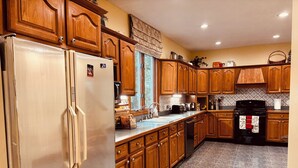 Coffee/tea maker, fridge, microwave, oven