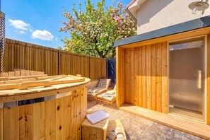 A wooden sauna area with a bench, a chair, and a table. - Istrian Casa Pr Marici Relaxing Vineyard, Koper, Slovenia (Koper)