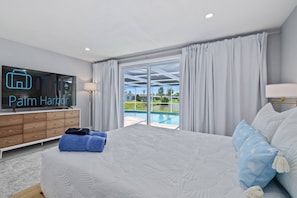 3 bedrooms, desk, iron/ironing board, travel crib - Luxury 3BR Home w/ Heated Pool, Outdoor TV, Bikes & BBQ – Perfect for Families with Modern Kitchen! (Port Richey)