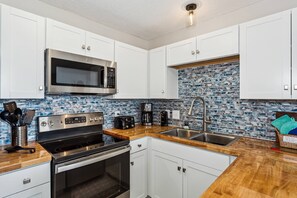 Fridge, microwave, oven, stovetop - Completely Renovated 1BR Condo at Grand Caribbean West |Steps Away from the Gulf |Snowbird Friendly (Pensacola)