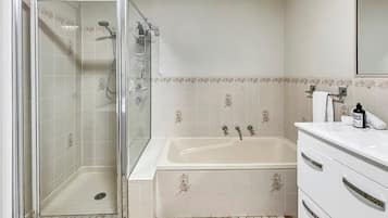 Shower, hair dryer, towels, shampoo