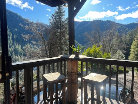Property grounds. A guesthouse with panoramic mountain and river views with private bathroom