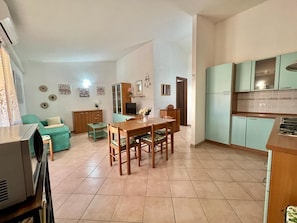 Apartment | Living area | 22-inch flat-screen TV with cable channels