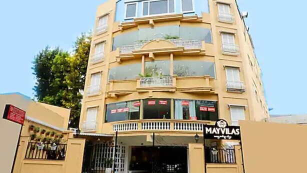 A multi-story building with a storefront labeled "MAYVILAS." - Hotel Mayvillas Luxury Boutique Stay (Dehradun)