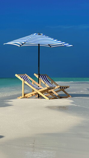 Private beach, white sand, beach umbrellas