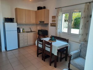Apartment | Private kitchen | Full-size fridge, oven, electric kettle, toaster - Crete Country Escape 2 Bd w Patio (Hersonissos)