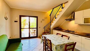 Apartment | Living area | 22-inch flat-screen TV with cable channels