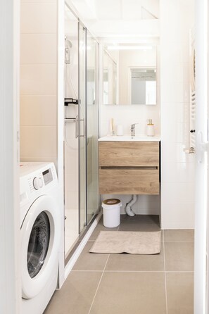 Shower, hair dryer, towels, soap