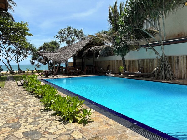 Outdoor pool, pool umbrellas, pool loungers