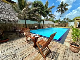 Outdoor pool, pool umbrellas, sun loungers