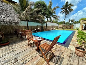 Outdoor pool, pool umbrellas, pool loungers