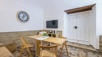 Deluxe-Apartment | Wohnbereich | Flachbildfernseher