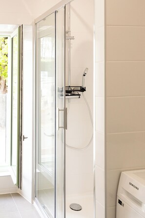 Shower, hair dryer, towels, soap