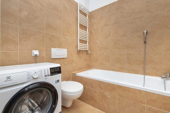 Shower, hair dryer, towels, shampoo