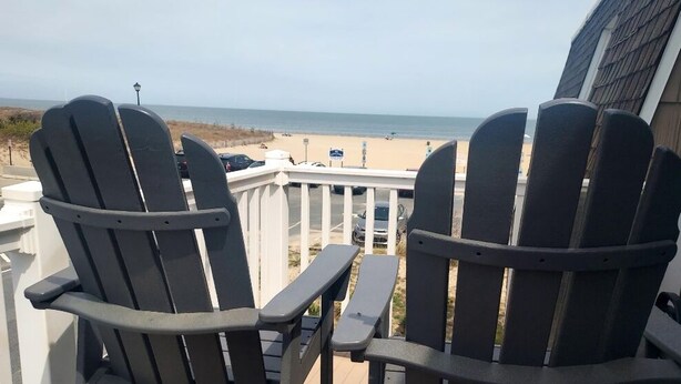 Two Adirondack chairs facing a beach view. - Bayview Condo right on Lewes Beach (Lewes)