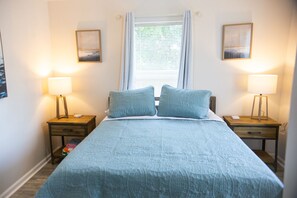 1 bedroom, desk, iron/ironing board, travel crib