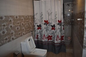 Shower, rainfall showerhead, towels, soap