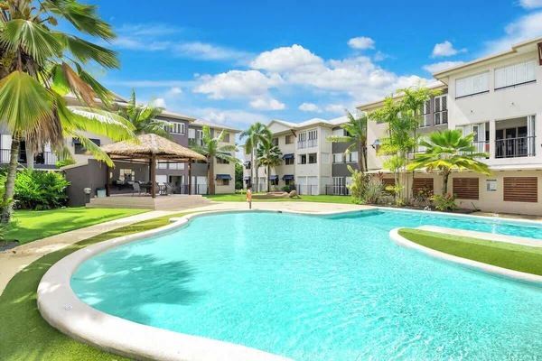 Dive into the shared pool, surrounded by lush greenery. It’s a tranquil haven where you can relax, sunbathe, or take a refreshing swim, perfect for unwinding and enjoying the tropical atmosphere.