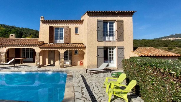 A two-story house with a swimming pool, outdoor seating, and a view of the surrounding landscape. - Faïza  - Four Bedroom Villa, Sleeps 8 (Roquebrune-sur-Argens)