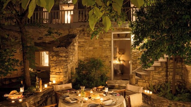 An outdoor dining area with stone walls, a table set for two, and candles. - AMPLE PLACES Monadiko House
Traditional house in the center of Lefkara village (Pano Lefkara)