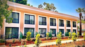 A modern building with multiple windows and a flat roof.