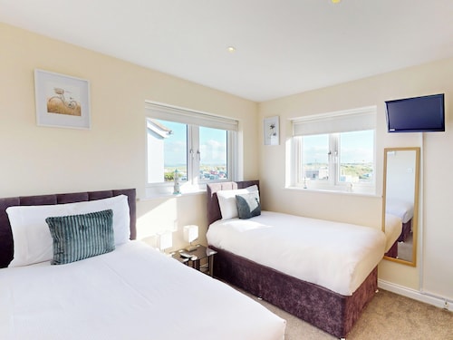 Discover coastal bliss at The Dunes, your perfect family haven by Beadnell Bay.