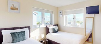 Discover coastal bliss at The Dunes, your perfect family haven by Beadnell Bay.