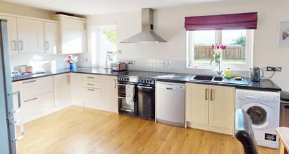 Discover coastal bliss at The Dunes, your perfect family haven by Beadnell Bay.