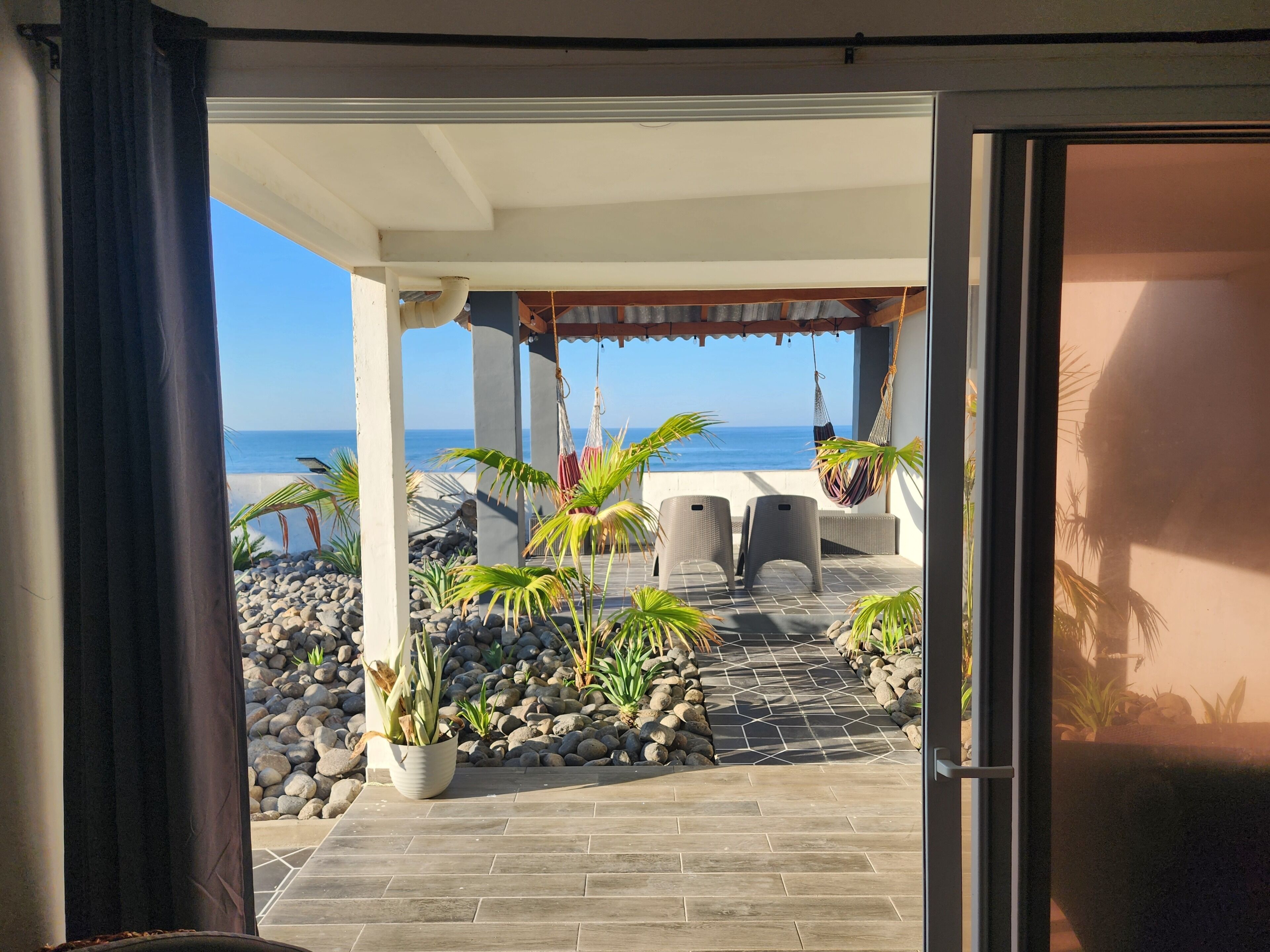 walk out to covered patio overlooking ocean from master bedroom 