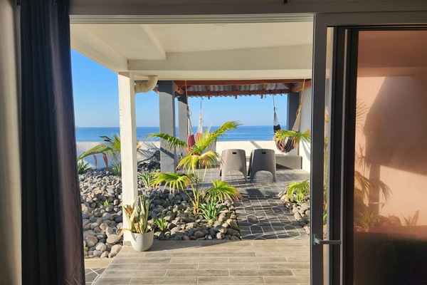 walk out to covered patio overlooking ocean from master bedroom