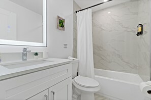 Hair dryer, towels, soap, shampoo