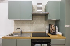 Deluxe Apartment | Private kitchen | Full-sized fridge, oven, stovetop, espresso maker