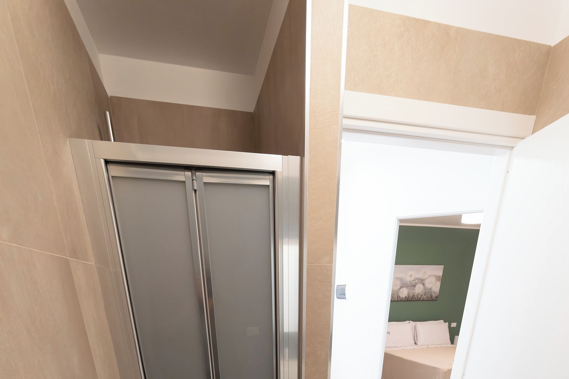 A bathroom with a shower, a toilet, and a sink.