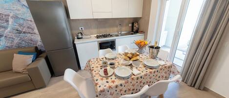 Deluxe Apartment | Private kitchen | Full-sized fridge, microwave, stovetop, espresso maker