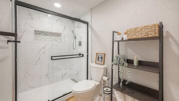 Shower, hair dryer, towels, soap