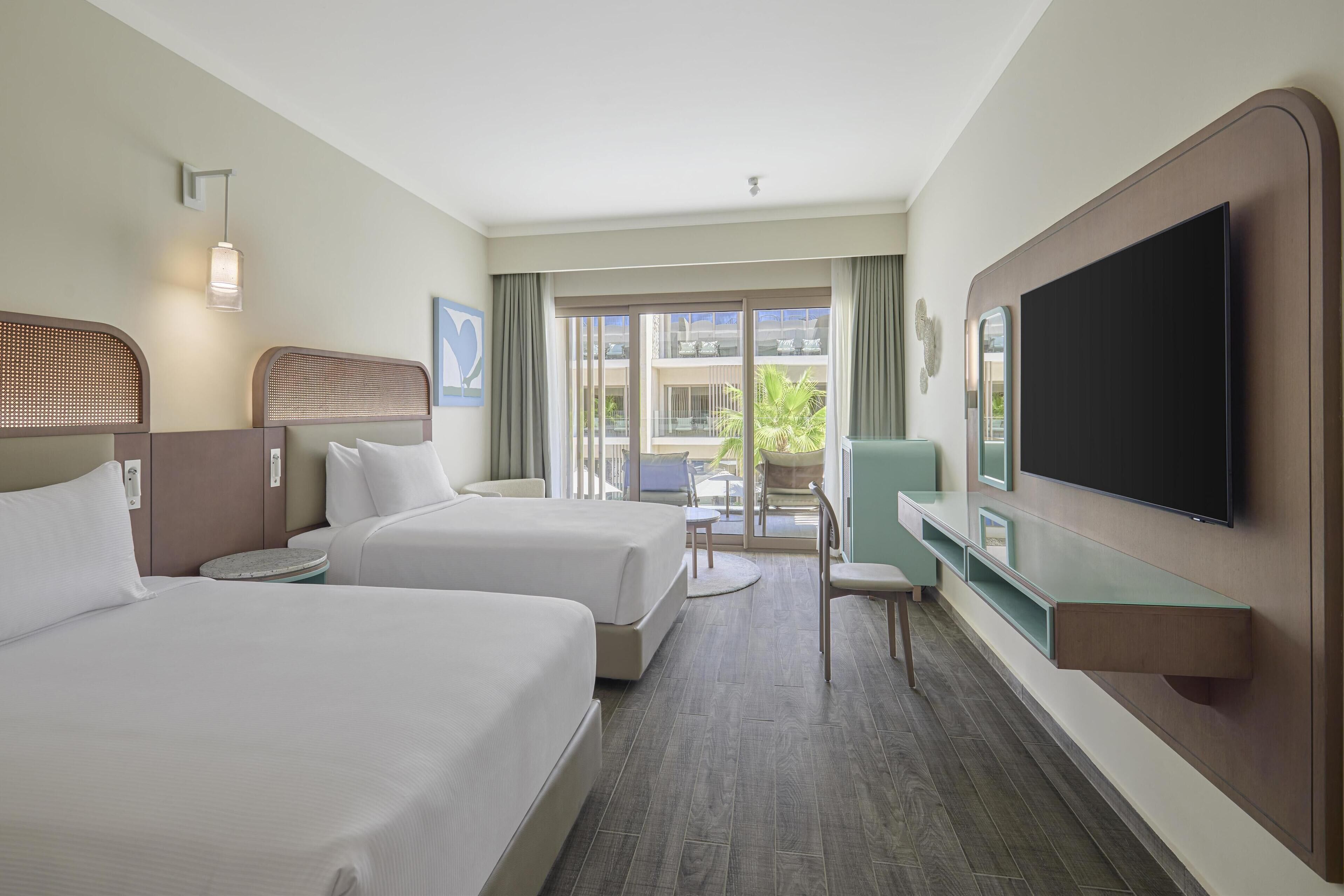 Premium bedding, down comforters, pillowtop beds, in-room safe